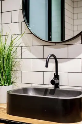 a black sink in a bathroom with a mirror at Magnifique Appartement 3P in Nice