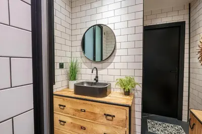 a bathroom with a sink and a mirror at Magnifique Appartement 3P in Nice