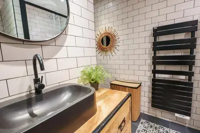 a bathroom with a sink and a mirror at Magnifique Appartement 3P in Nice