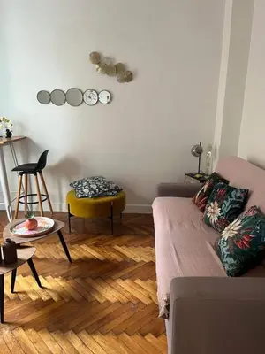 a living room with a couch and a table at Studio ideally located Nice City Center in Nice