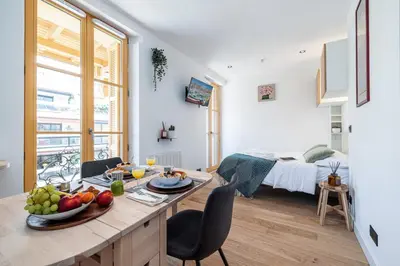 a kitchen and living room with a table with fruit on it at MY CASA - BUFFA 3-53 - Superb Studio Suite City Center in Nice