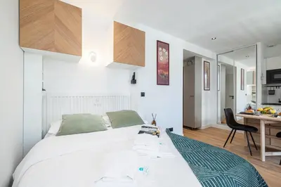 a bedroom with a bed and a desk with a chair at MY CASA - BUFFA 3-53 - Superb Studio Suite City Center in Nice