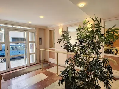 a potted plant in a room with a building at Nestor&Jeeves - VILLA HARMONIE TERRASSE - Central - Free parking in Nice