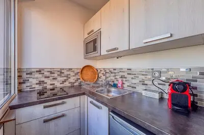 a kitchen with a sink and a counter top at Contemporary 2P Studio Just Steps from the Beach in Cagnes-sur-Mer