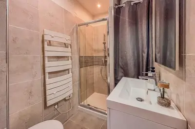 a bathroom with a toilet and a shower and a sink at Contemporary 2P Studio Just Steps from the Beach in Cagnes-sur-Mer