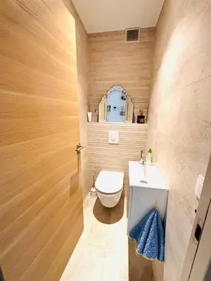 a bathroom with a toilet and a sink at Les Floralies - Beaulieu-sur-Mer in Beaulieu-sur-Mer