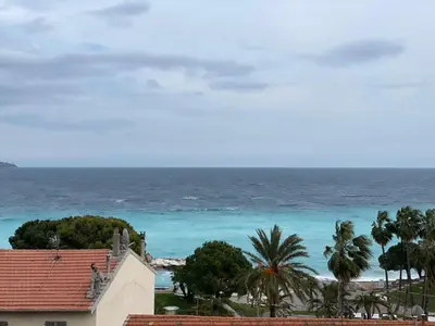 a view of the ocean from a house at STUDIO EN FACE DE LA PLAGE AVEC une VUE FANTASTIQUE ! in Nice