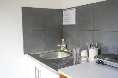 a kitchen with a sink and a counter top at Alpazur in Nice