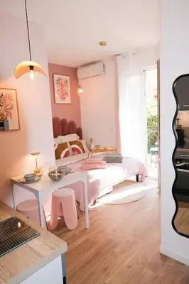a room with a bed and a guitar in it at Casa Luna in Nice