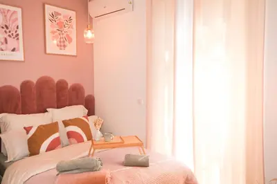 a bedroom with a large bed with a wooden headboard at Casa Luna in Nice