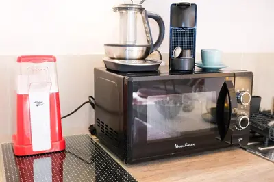 a toaster oven with a blender on top of it at Casa Luna in Nice