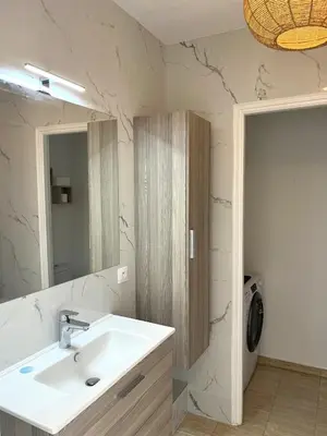 a bathroom with a sink and a mirror at Beautiful studio with parking place Massena in Nice