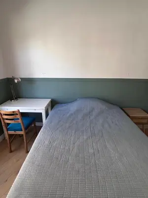 a bed in a room with a desk and a bed sidx sidx sidx at Shared flat in Liberation in Nice