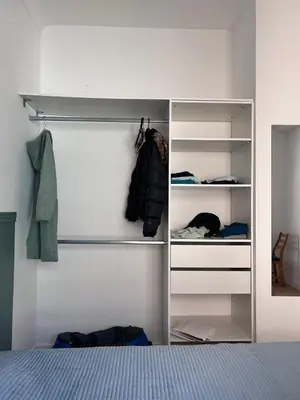 a bedroom with a white closet with shelves at Shared flat in Liberation in Nice
