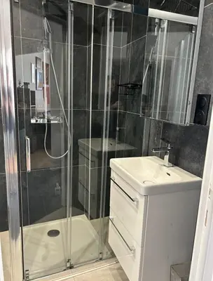 a bathroom with a shower and a toilet and a sink at Shared flat in Liberation in Nice