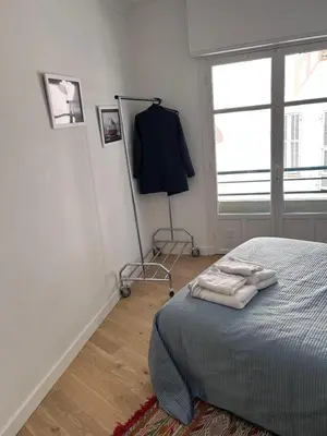 a bedroom with a bed with three towels on it at Shared flat in Liberation in Nice