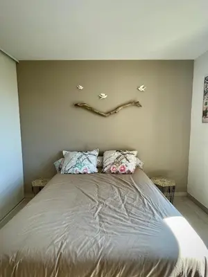 a bedroom with a bed and a large window at Appartement 2P Cros de Cagnes à 2 pas de la mer in Cagnes-sur-Mer