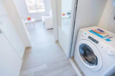 a white washer and dryer in a room at Joli Studio proche Promenade des Anglais in Nice