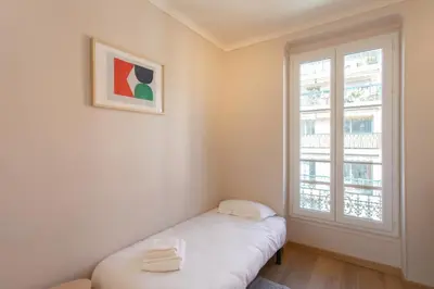 a small room with a window and a white couch at #25 2BDR Port, 5min from the Old Town Balcony, AC&WIFI in Nice