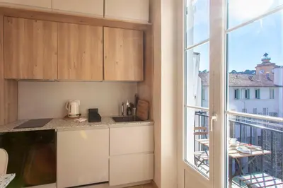 a kitchen with a view of a balcony at #25 2BDR Port, 5min from the Old Town Balcony, AC&WIFI in Nice