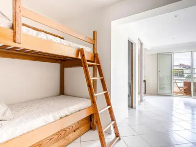 a room with two bunk beds and a hallway at Apartment Le Mirazur by Interhome in Nice