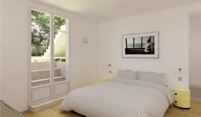 a living room with a table and a kitchen at Nice Cote d'Azur jardin parking 6 pers luxe in Nice