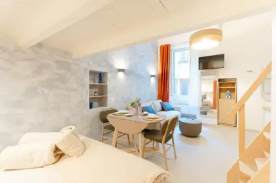 a room with a bed and a table and chairs at New- Cozy apartment -4 guests - Air conditioning in Nice