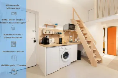 a laundry room with a washing machine and a staircase at New- Cozy apartment -4 guests - Air conditioning in Nice