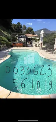 a picture of a swimming pool with a sign on it at Beautiful villa Nice in Nice