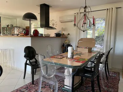 a dining room with a glass table and chairs at Beautiful villa Nice in Nice