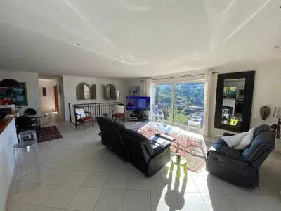 a living room with two couches and a television at Beautiful villa Nice in Nice