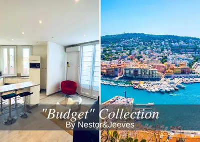 a kitchen and a living room with a view of a harbor at Nestor&Jeeves - PALAIS LASCARIS - Port in Nice