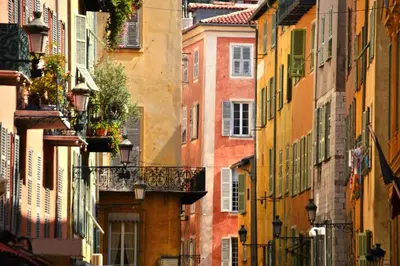an alley in an old city with buildings at Nestor&Jeeves - PALAIS LASCARIS - Port in Nice