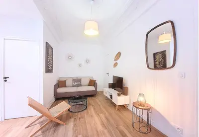 a living room with a couch and a mirror at Nestor&Jeeves - COCOA BEACH - Central - Near Beach in Nice