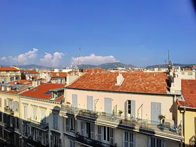 a group of buildings with red roofs in a city at Nestor&Jeeves - CHAISE BLEUE - Central - Near Beach in Nice