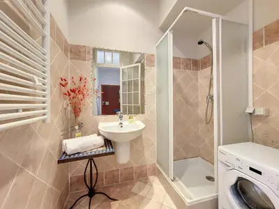 a bathroom with a sink and a washing machine at Nestor&Jeeves - PANTAI - Near Beach - Balcony in Nice