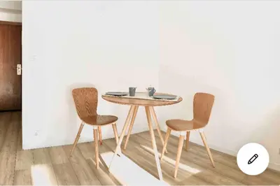 a table and two chairs in a room at Studio Nice clim wifi in Nice
