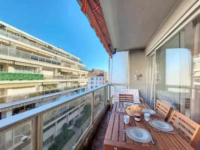 a balcony with a table and chairs on a building at Nestor&Jeeves - CLEA - Terrasse - Central in Nice