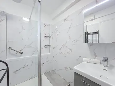 a white bathroom with a shower and a sink at Nestor&Jeeves - CLEA - Terrasse - Central in Nice