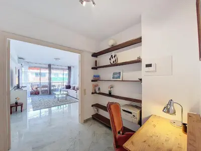 a living room with a table and a dining room at Nestor&Jeeves - CLEA - Terrasse - Central in Nice