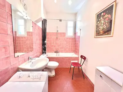 a bathroom with a sink and a toilet and a tub at E OP Duplex d Antoine Old Port - Old Town in Nice
