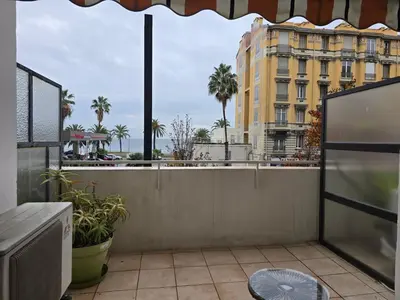 a balcony with a view of a building at Large T2 50m from the beaches in Nice
