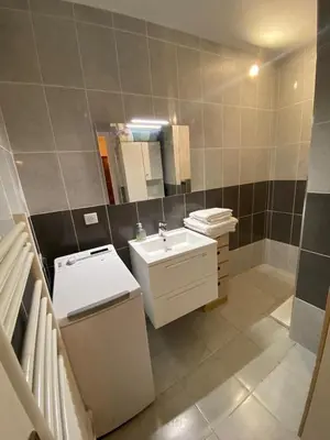a bathroom with a sink and a toilet and a mirror at T2 Proche plage - Centre cagnes sur mer in Cagnes-sur-Mer