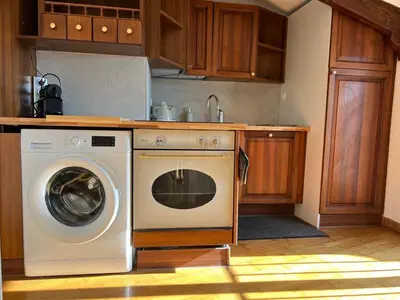 a kitchen with a washing machine and a sink at Charming peaceful haven in the Golden Square, air-conditioned in Nice