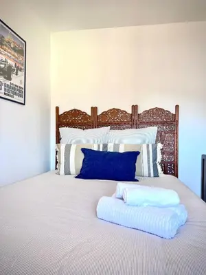a bed with two pillows on top of it at Charming peaceful haven in the Golden Square, air-conditioned in Nice
