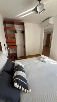 a bedroom with a large bed with two pillows on it at Charming peaceful haven in the Golden Square, air-conditioned in Nice