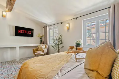 a bedroom with a bed and a window at Nice Renting - CENTRALE - Authentic Loft Old Nice Rooftop View & Charm in Nice