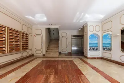 a large room with a staircase and a room with a stair case at Jolie studio avec belle terrasse ensoleillee in Nice