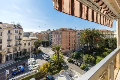 a view of a city street from a balcony at Jolie studio avec belle terrasse ensoleillee in Nice