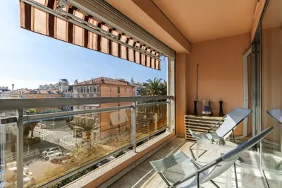 a balcony with a view of a city at Jolie studio avec belle terrasse ensoleillee in Nice